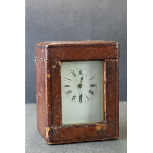 185 - An early 20th century brass cased carriage clock, complete with travel case and key.