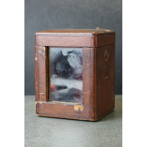 185 - An early 20th century brass cased carriage clock, complete with travel case and key.