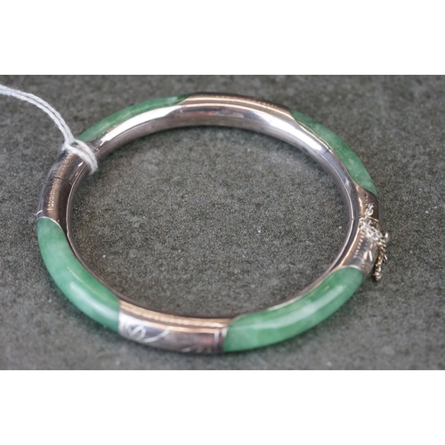 189 - A 925 silver mounted jade bangle.