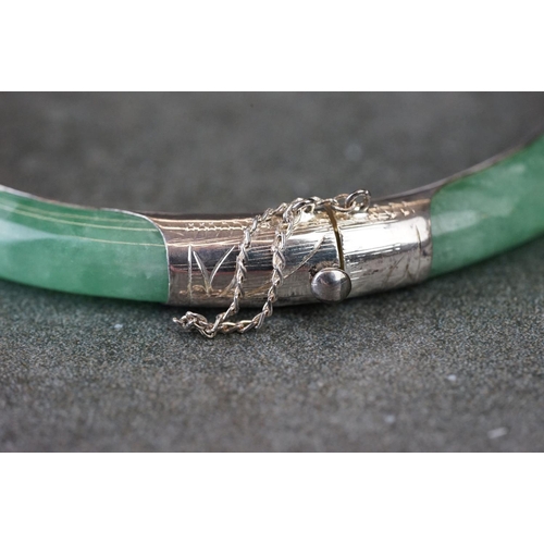 189 - A 925 silver mounted jade bangle.