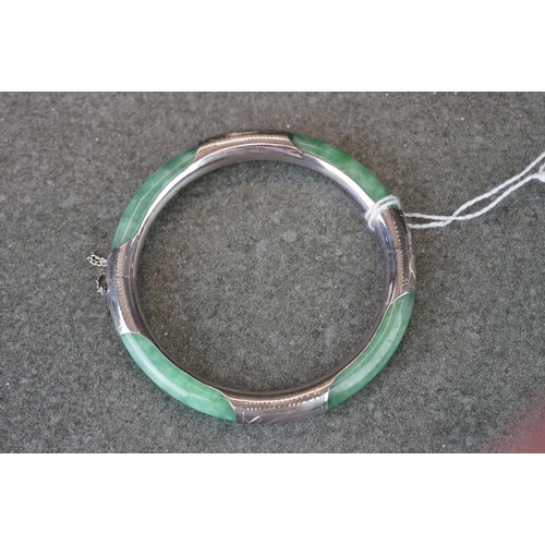 189 - A 925 silver mounted jade bangle.