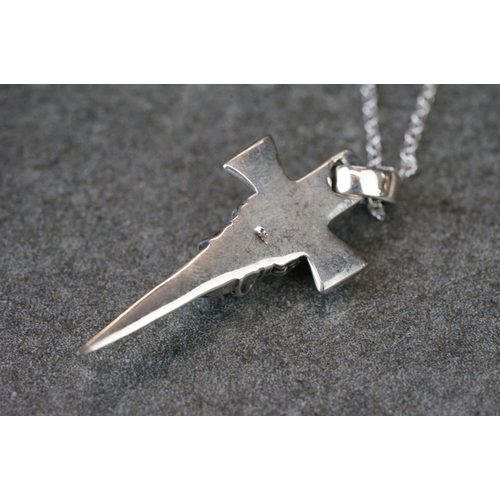191 - Silver cross necklace with embossed skull decoration