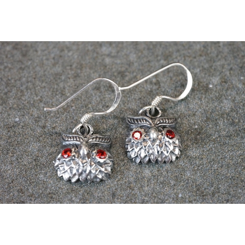 193 - Pair of silver owl earrings with ruby eyes