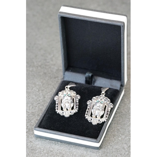 206 - Cased pair of silver cat style earrings