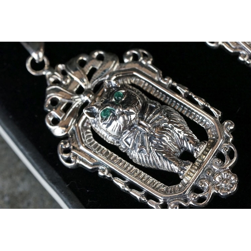 206 - Cased pair of silver cat style earrings