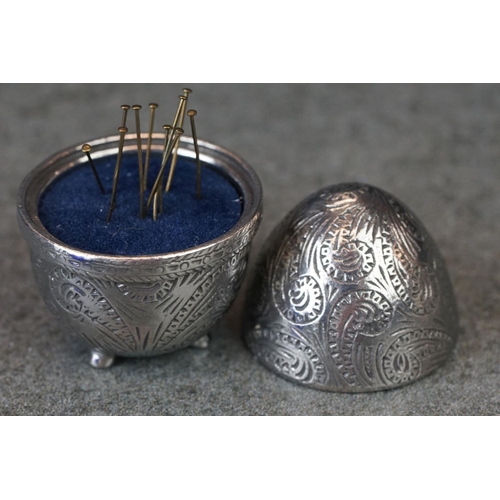 214 - A small group of collectables to include a blue glass scent bottle, watch winder and a pin cushion.
