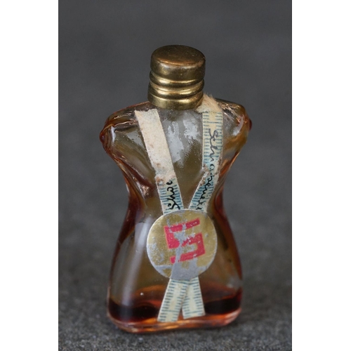 214 - A small group of collectables to include a blue glass scent bottle, watch winder and a pin cushion.