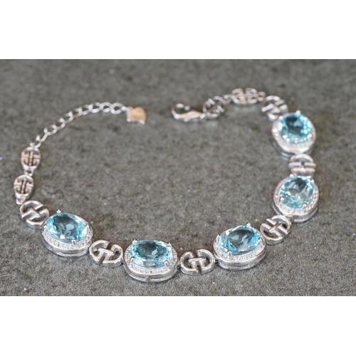 225 - Silver, CZ & blue topaz bracelet
