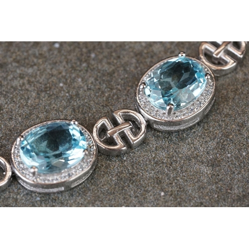 225 - Silver, CZ & blue topaz bracelet