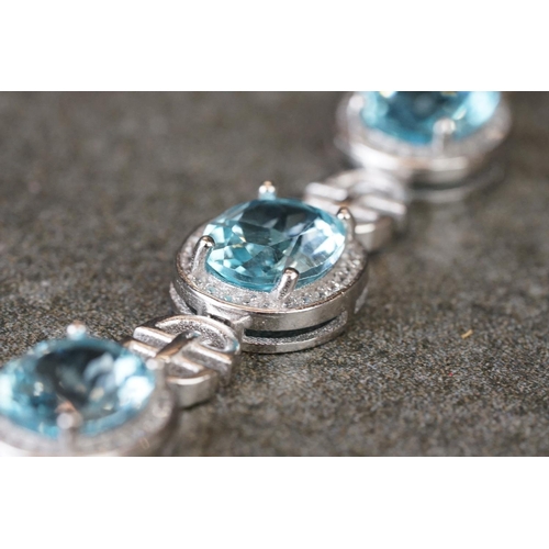 225 - Silver, CZ & blue topaz bracelet