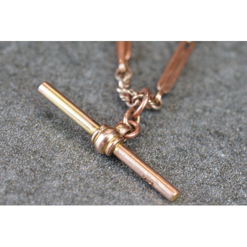 231 - A collection of yellow gold jewellery to include necklace, bracelet, brooch and Albert chain.