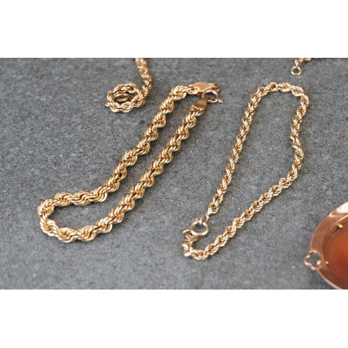 231 - A collection of yellow gold jewellery to include necklace, bracelet, brooch and Albert chain.