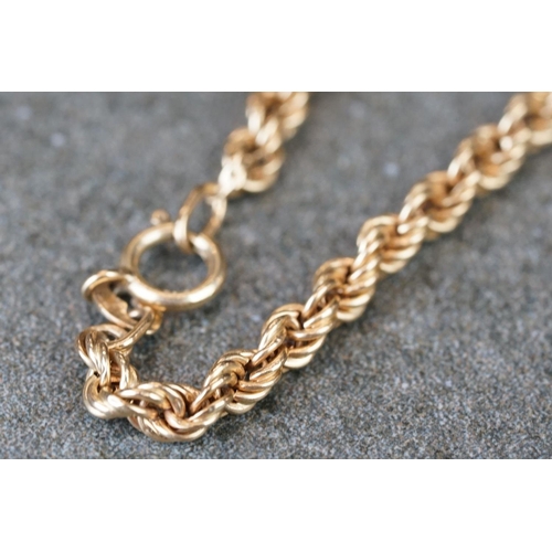 231 - A collection of yellow gold jewellery to include necklace, bracelet, brooch and Albert chain.