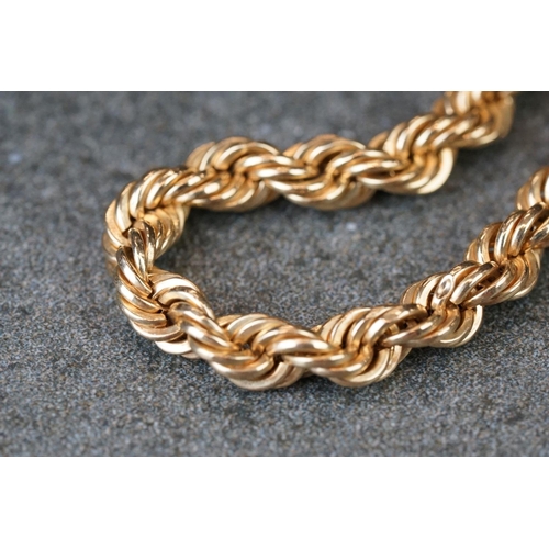 231 - A collection of yellow gold jewellery to include necklace, bracelet, brooch and Albert chain.