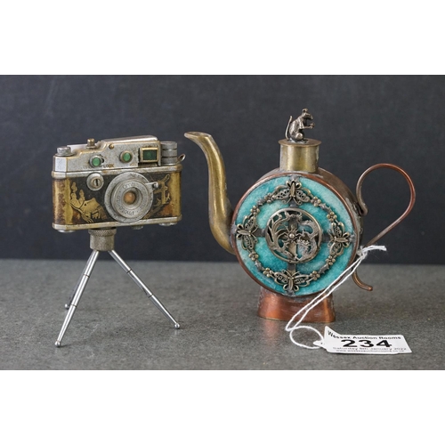 234 - A Japanese novelty table lighter in the form of a camera together with a miniature oriental teapot.