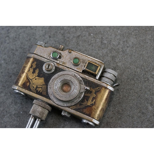 234 - A Japanese novelty table lighter in the form of a camera together with a miniature oriental teapot.