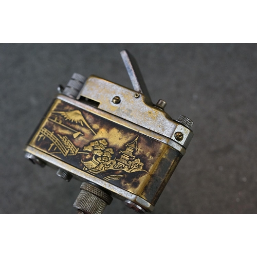234 - A Japanese novelty table lighter in the form of a camera together with a miniature oriental teapot.