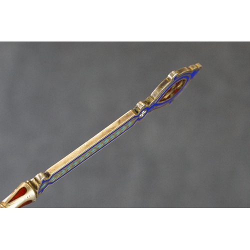 235 - A hallmarked Russian silver and enamel decorative spoon.