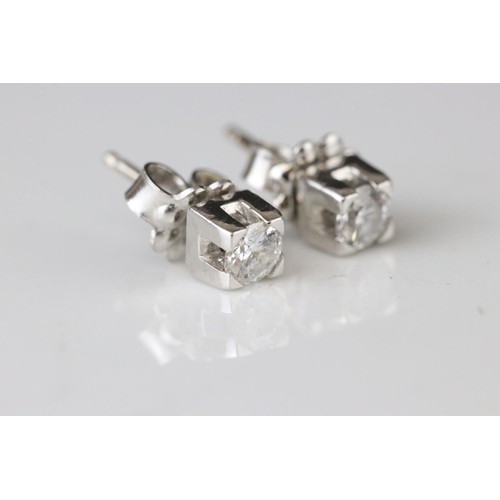 194A - Pair of diamond 18ct white gold stud earrings, round brilliant cut diamond weighing approx 0.25 cara... 