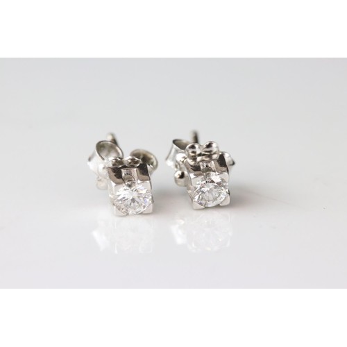 194A - Pair of diamond 18ct white gold stud earrings, round brilliant cut diamond weighing approx 0.25 cara... 