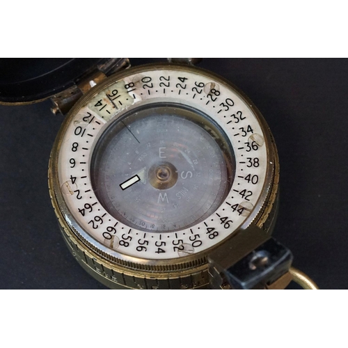 64 - A World War Two British Military Marching Compass, Dated 1943 And Made By T.G.Co Ltd. London And Mar... 