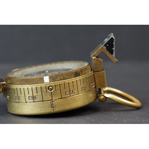 64 - A World War Two British Military Marching Compass, Dated 1943 And Made By T.G.Co Ltd. London And Mar... 