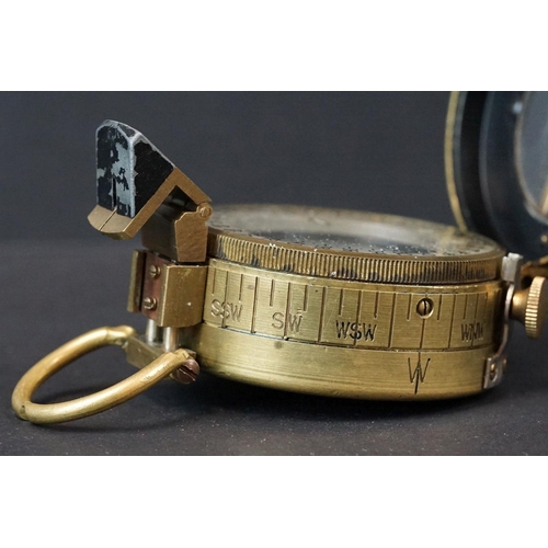 64 - A World War Two British Military Marching Compass, Dated 1943 And Made By T.G.Co Ltd. London And Mar... 