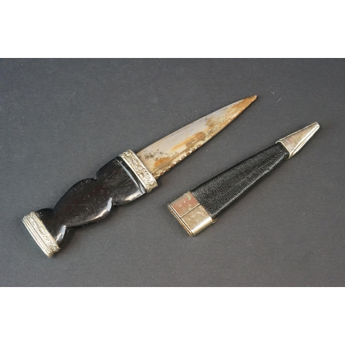 81 - A Scottish Sgian-Dubh Dagger With Fitted Sheath With Thistle Decoration To White Metal.