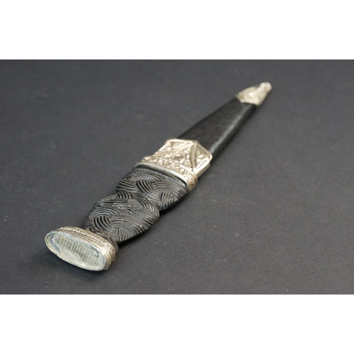 81 - A Scottish Sgian-Dubh Dagger With Fitted Sheath With Thistle Decoration To White Metal.