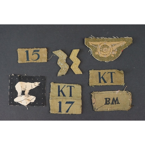 83 - A Collection Of Approx Twenty Military Cloth Badges To Include Fire Guard Armband, WW2 Medal Bar And... 