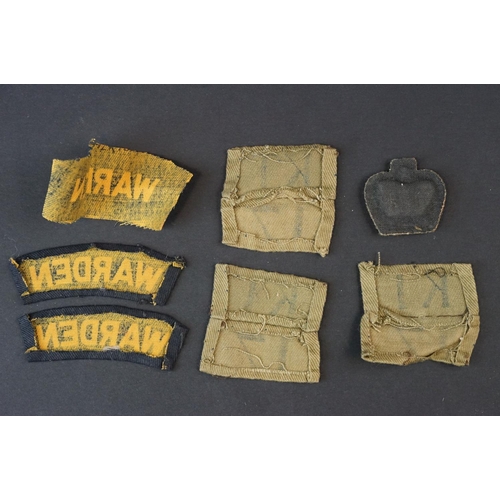 83 - A Collection Of Approx Twenty Military Cloth Badges To Include Fire Guard Armband, WW2 Medal Bar And... 