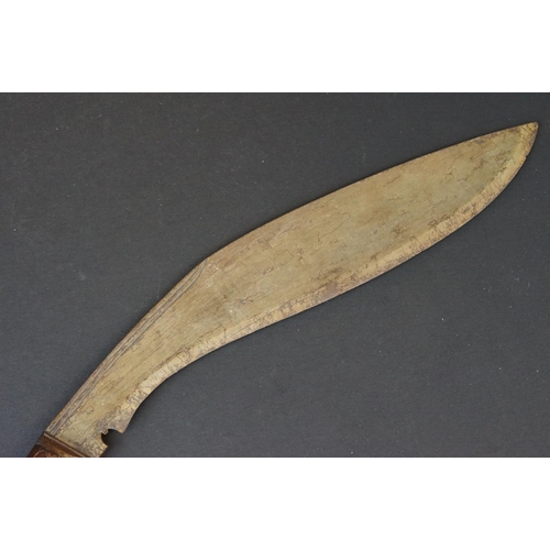 94 - A vintage Kukri knife with polished wooden handle.