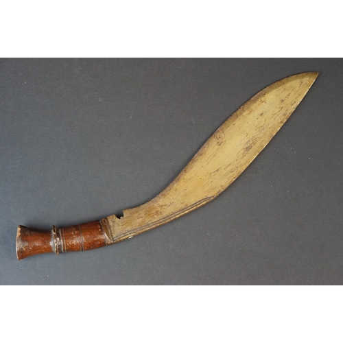 94 - A vintage Kukri knife with polished wooden handle.