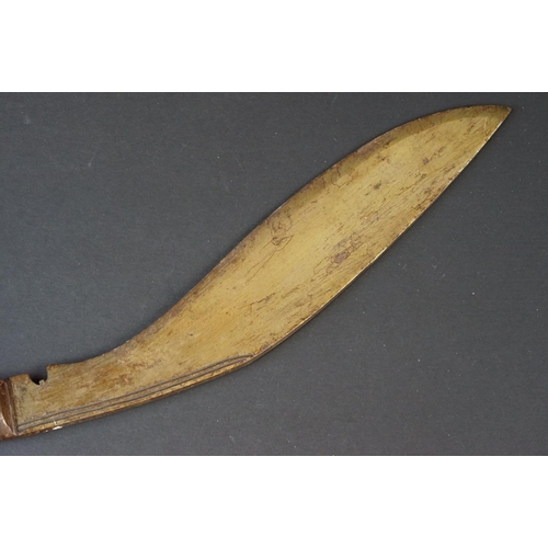 94 - A vintage Kukri knife with polished wooden handle.