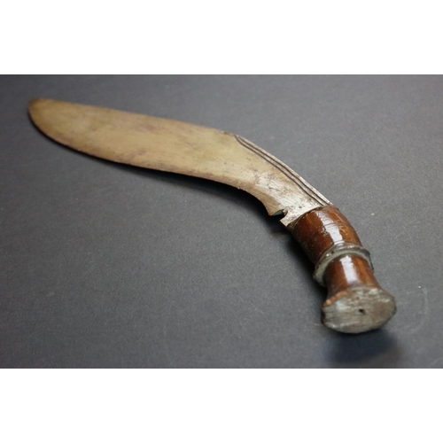 94 - A vintage Kukri knife with polished wooden handle.