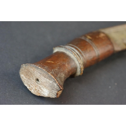 94 - A vintage Kukri knife with polished wooden handle.