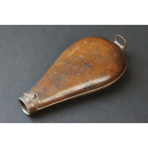 96 - A Collection Of Four Antique Gun Powder Flasks To Include Three Leather Examples.