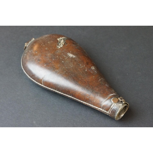 96 - A Collection Of Four Antique Gun Powder Flasks To Include Three Leather Examples.