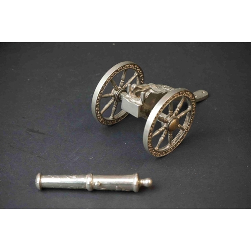 192 - A Collection Of Three Ornamental Metal Canon's To Include A Silver Plated Example.