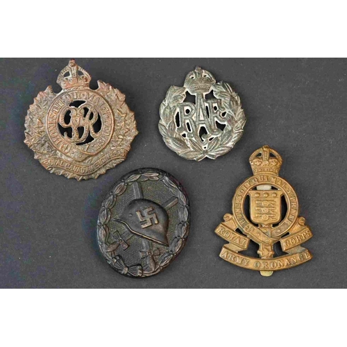 194 - A Collection Of Mainly British Military Badges To Include The Manchester Regiment Cap Badge, Royal A... 