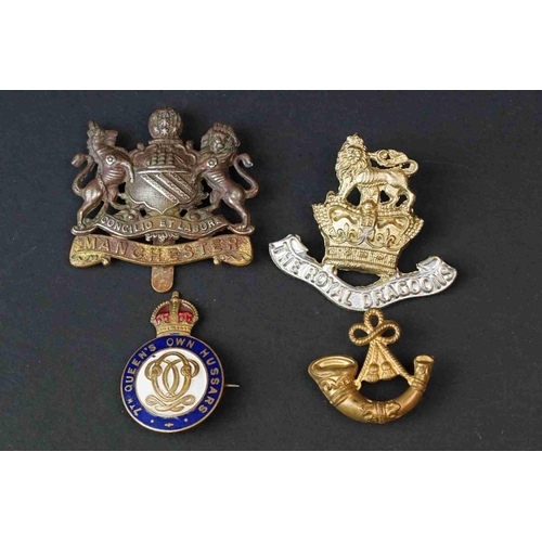 194 - A Collection Of Mainly British Military Badges To Include The Manchester Regiment Cap Badge, Royal A... 