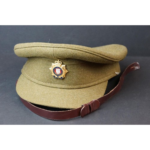 126 - A Collection Of Three Military Caps To Include A British Royal Logistics Corps Cap Complete With Cap... 