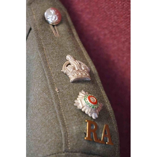 357 - A British Military Royal Artillery Officers Uniform To Include Jacket, Trousers, Cap And Belts.