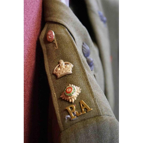 357 - A British Military Royal Artillery Officers Uniform To Include Jacket, Trousers, Cap And Belts.