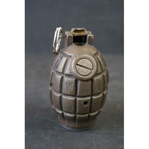 115A - A British World War One Inert Mills Grenade, Marked W L Complete With Clip And Pin.