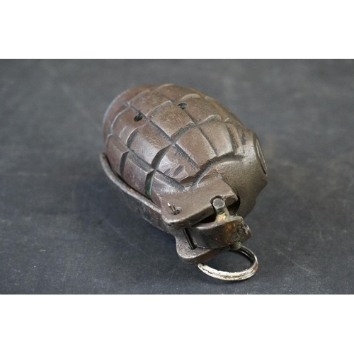 115A - A British World War One Inert Mills Grenade, Marked W L Complete With Clip And Pin.