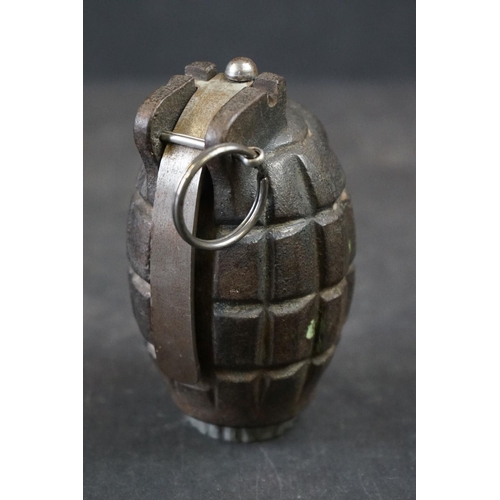 140A - A British World War One Inert Mills Grenade No.36M Mk.1 Complete With Clip And Pin.