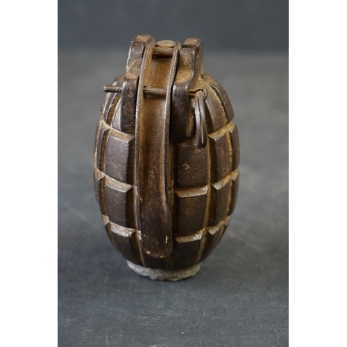 150A - A British World War One Inert Mills Grenade Complete With Clip And Pin.