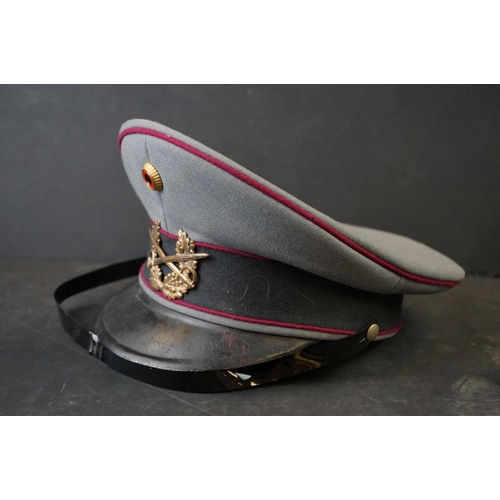 425 - A East German Military Officers Cap With Crossed Swords And laurel Cap Badge.