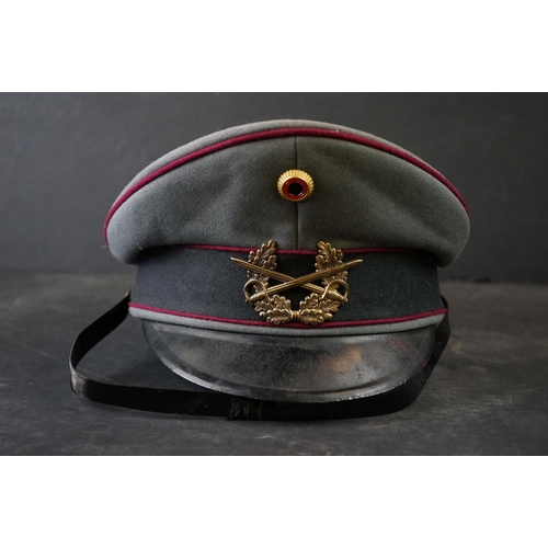 425 - A East German Military Officers Cap With Crossed Swords And laurel Cap Badge.